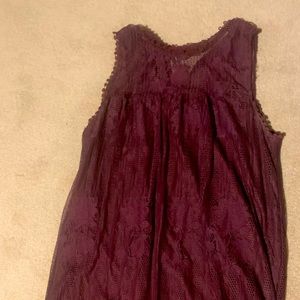 A burgundy color dress